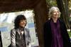 Emmanuelle Charpentier (L) and Jennifer Doudna walking in a park