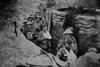 Bandaged British World War 1 soldiers in a battlefield trench, 1915-1918.