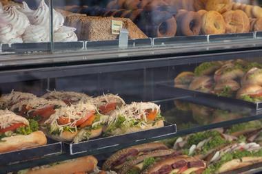 A picture showing food on display in a cafe