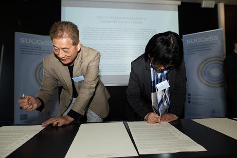 Researchers signing the declaration